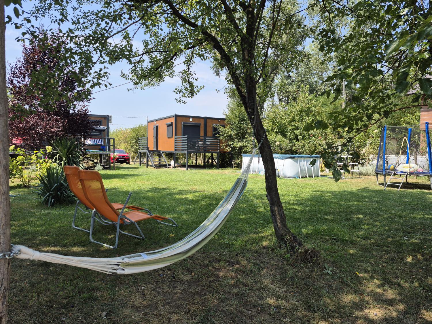 Cubes, pool and hammock in nature