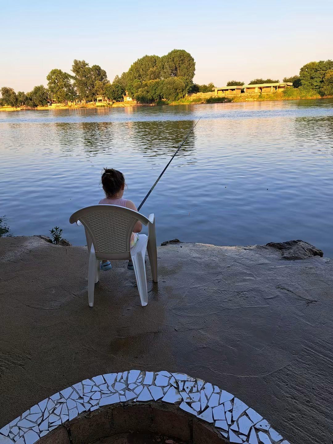 Child fishing by the Drina